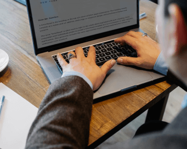 Document formatting professional working on business documents, improving quality and accessibility with document formatting.