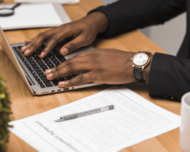 A man works with certified typing services ensuring compliance, accuracy, and formatting with business delivery support.