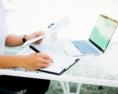 Typing expert working on laptop, representing competitive document typing rates for accurate and efficient results.