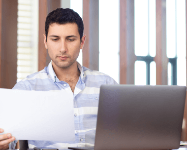 Client utilizing document typing service in Lansing to convert physical documents to digital format with precision and speed.