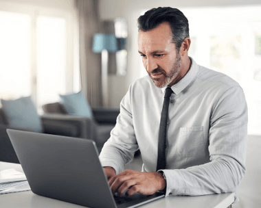 A man works on a laptop, symbolizing stress-free and flawless legal typing services in New York, delivered on time. A man works on a laptop, symbolizing stress-free and flawless legal typing services in New York, delivered on time.