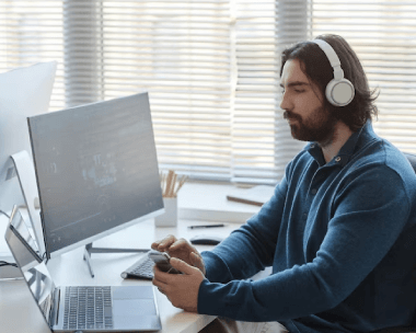 A professional typist diligently transcribes an audio recording.